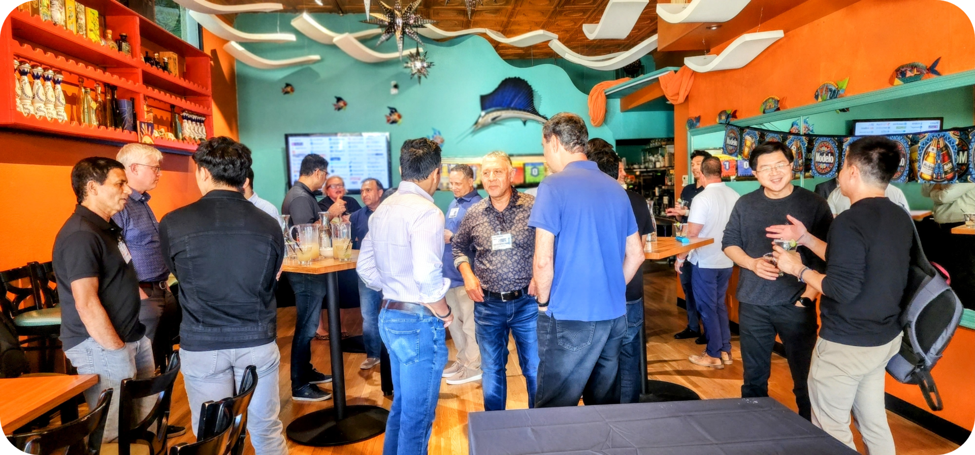 Group of men gathering at a bar.