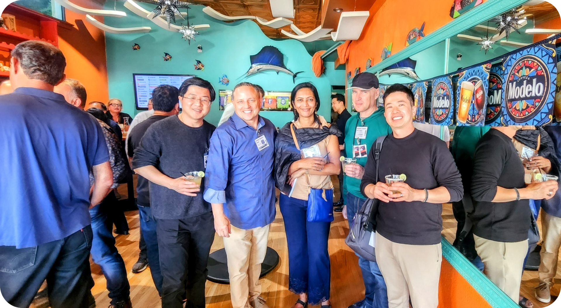 Group of friends enjoying drinks at a bar.