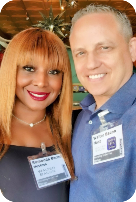 Two people with name tags at a conference.