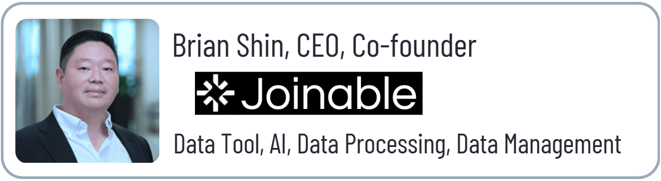 Portrait of a CEO with company logo.